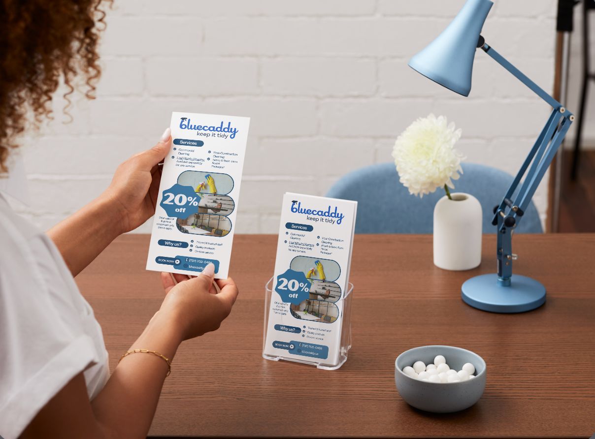 Bluecaddy flyers displayed on a clean desk with a blue lamp
